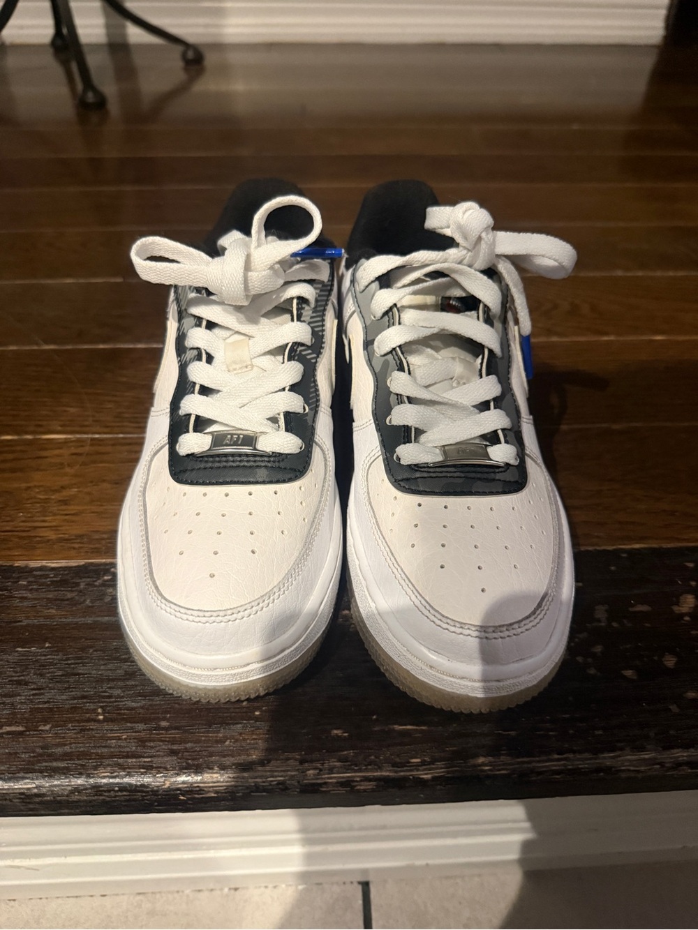 Nike Kids White Sneakers with Black and Blue Highlights